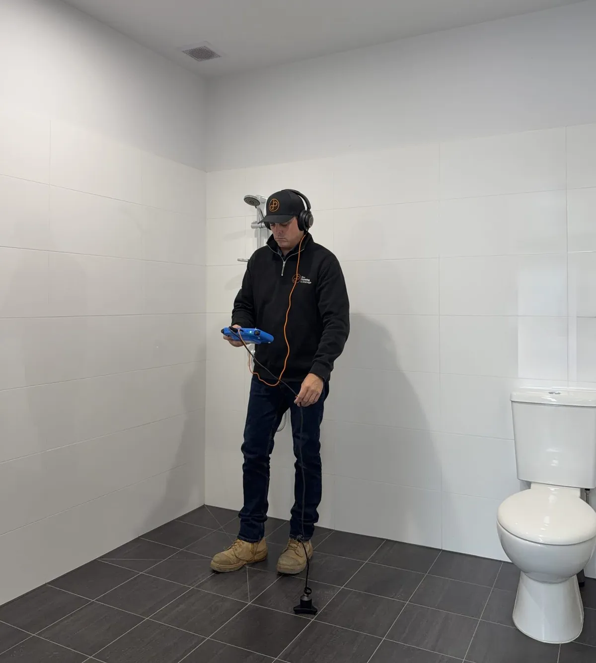Bay Plumbing technician using acoustic leak detection equipment
