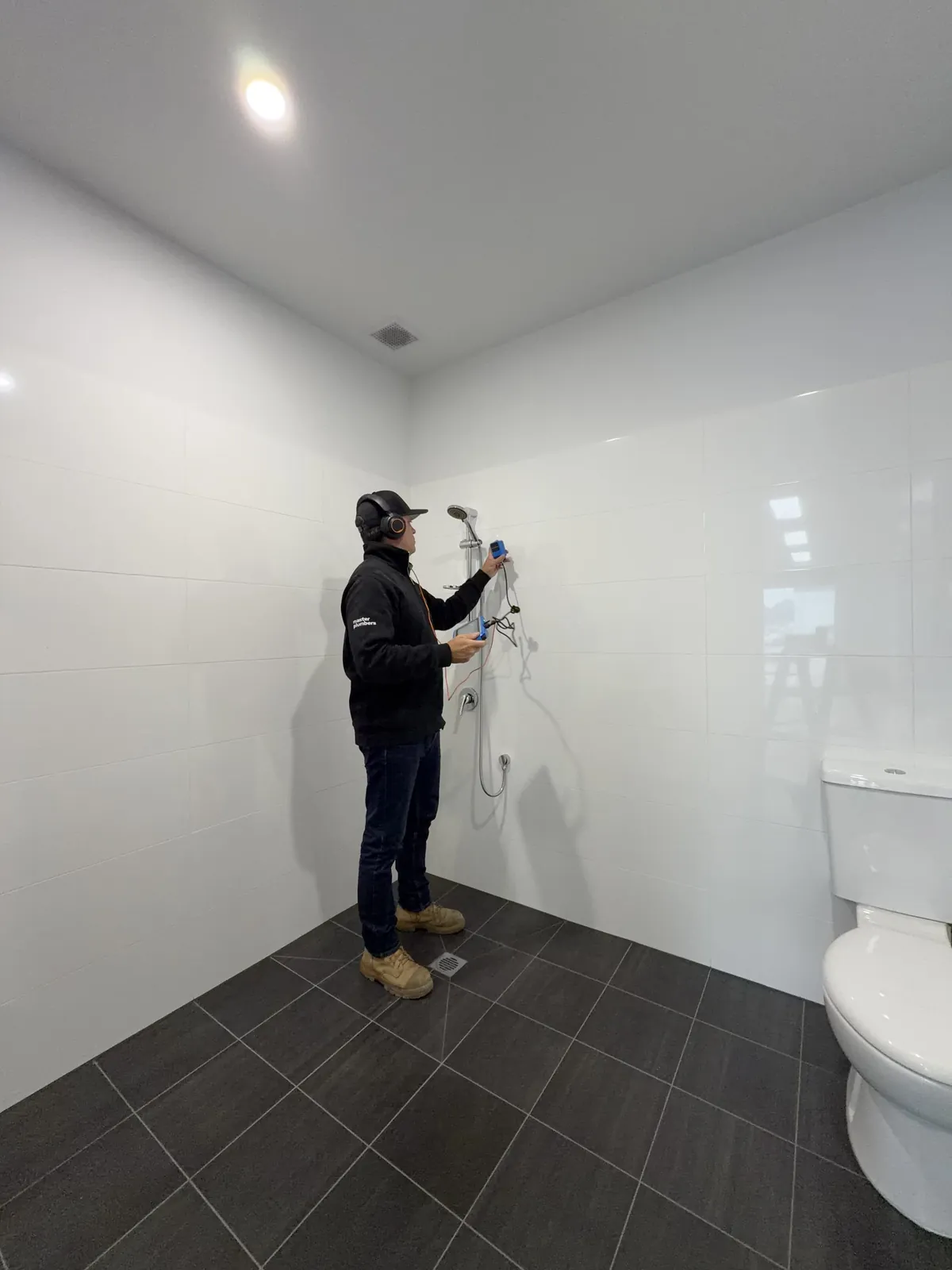 Bay Plumbing & Drainage Master Plumber using acoustic leak detection in a Geelong bathroom